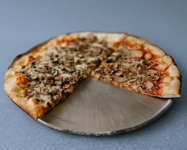 Fresh Mushroom Pizza Slice.